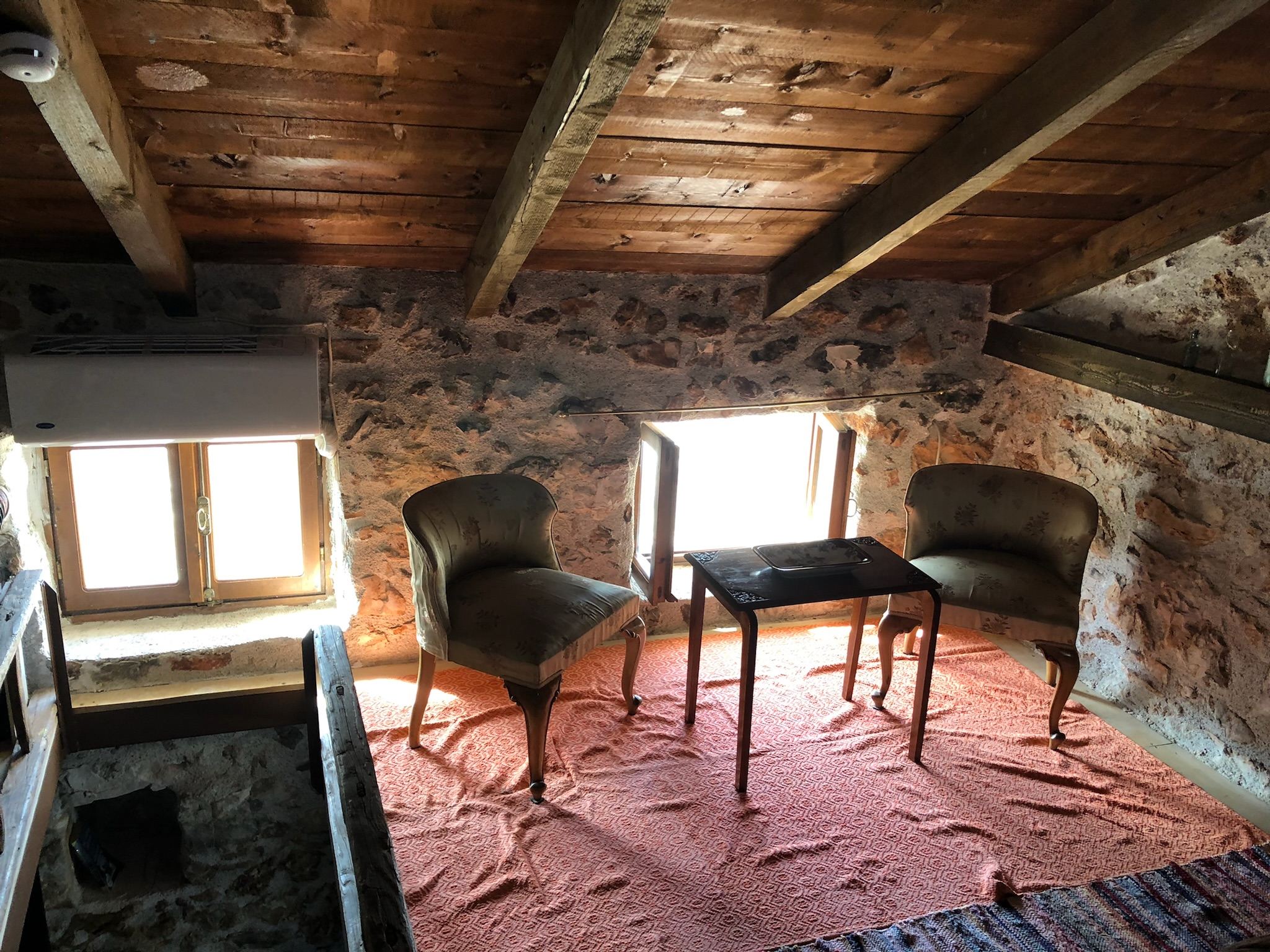 Upper loft with traditional stone walls