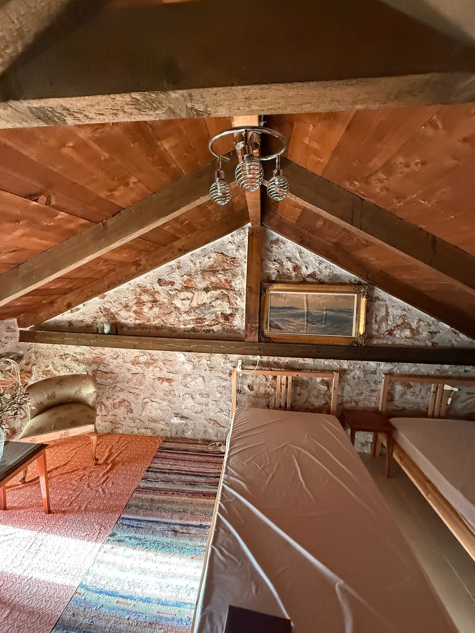 Twin beds beneath the timber roof
