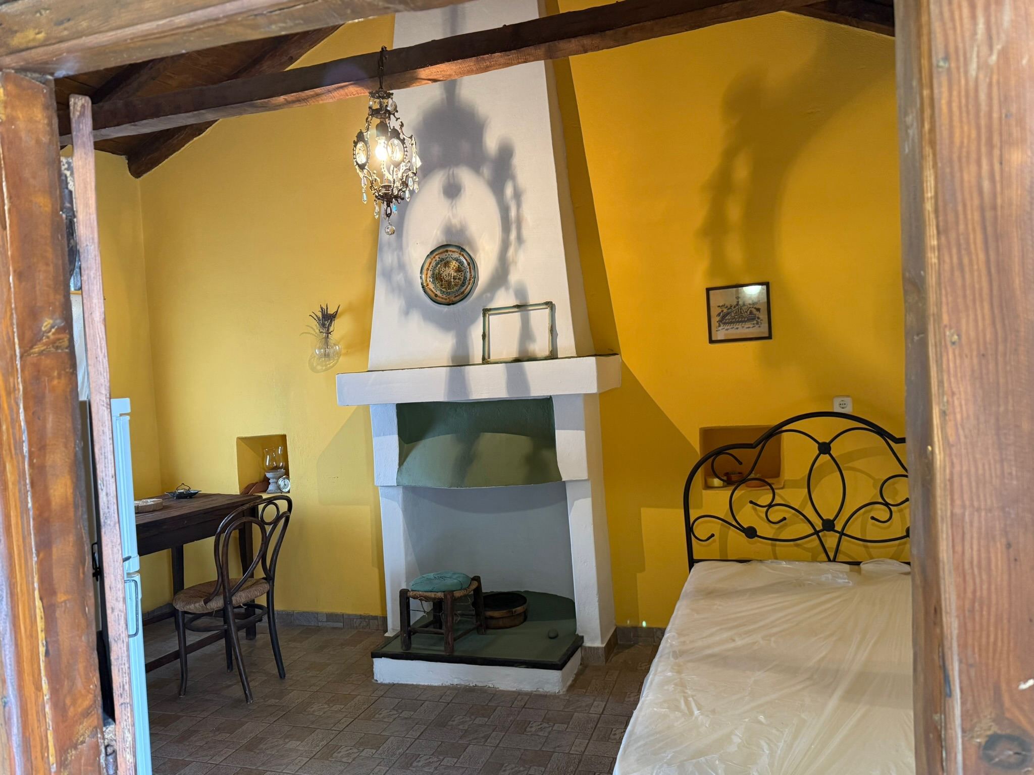 Ochre bedroom with fireplace