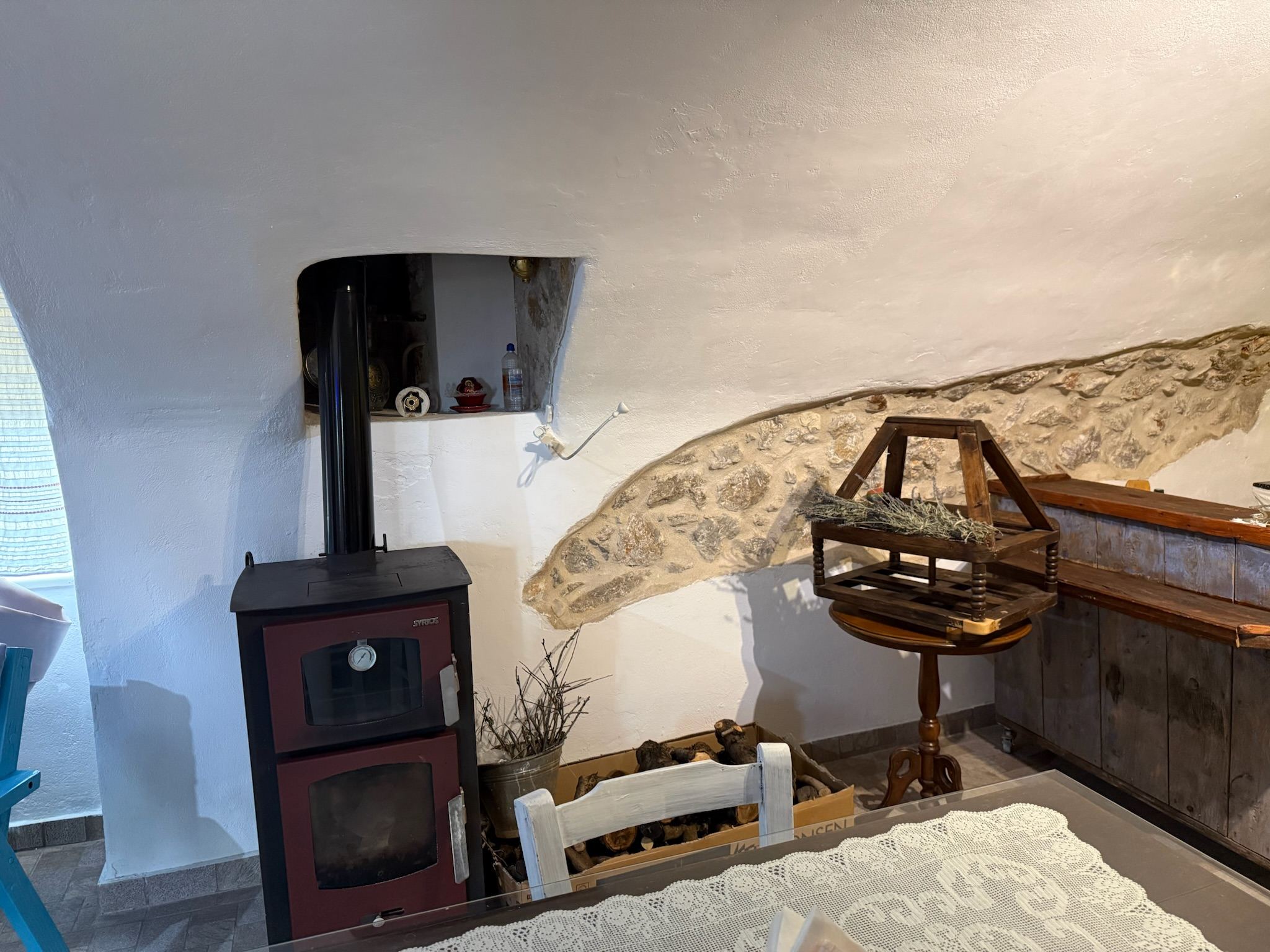 The original stone vault and wood stove