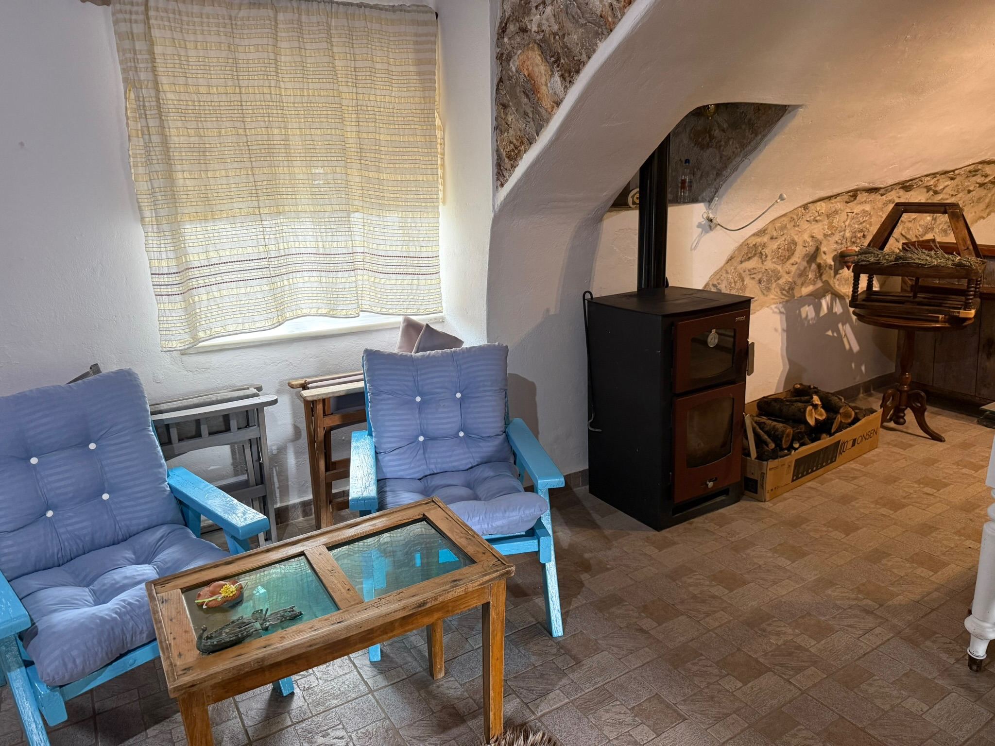 Wood stove beneath the stone arch