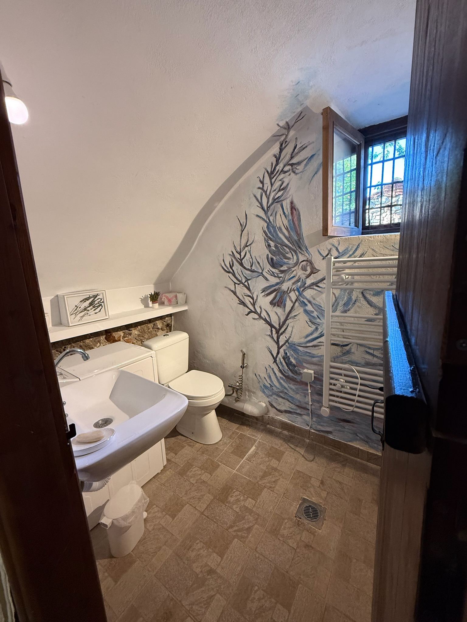 Bathroom with hand-painted botanical detail