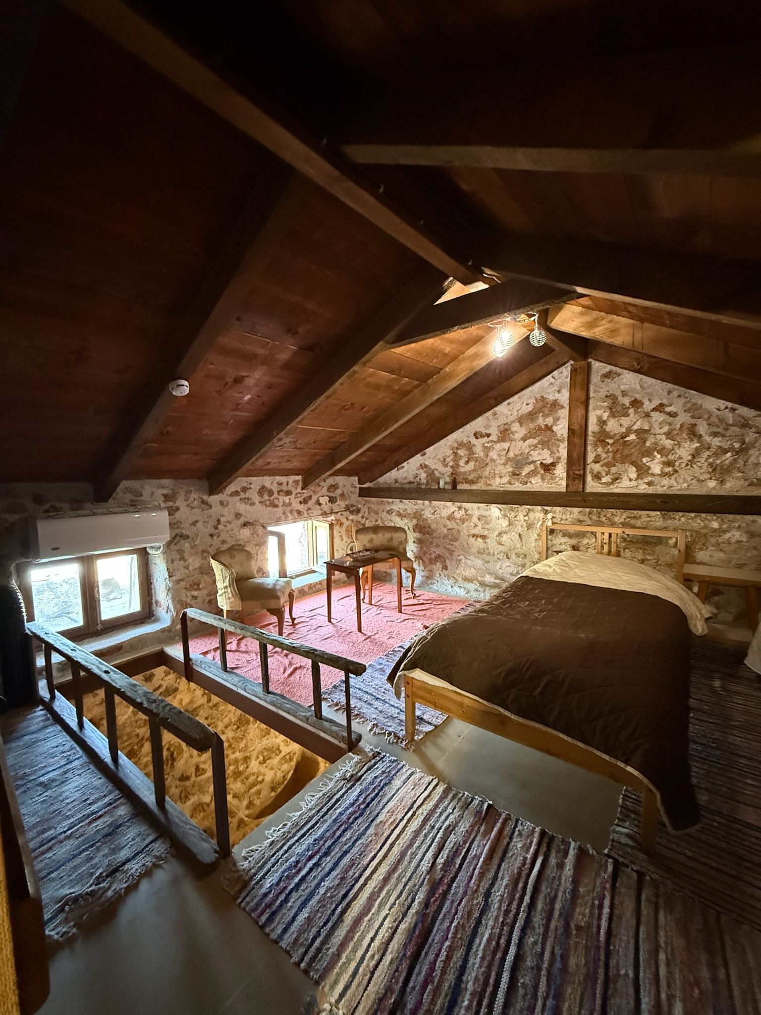 The loft beneath the pitched cedar roof