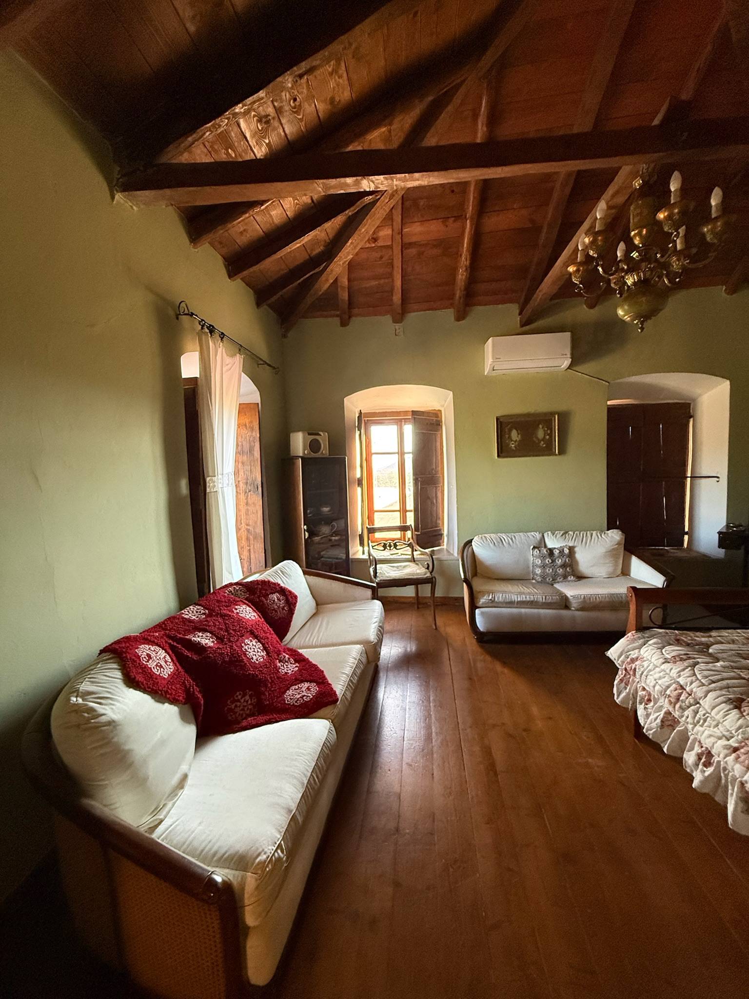 Oikos 1860 salon with timber ceiling and vintage furniture